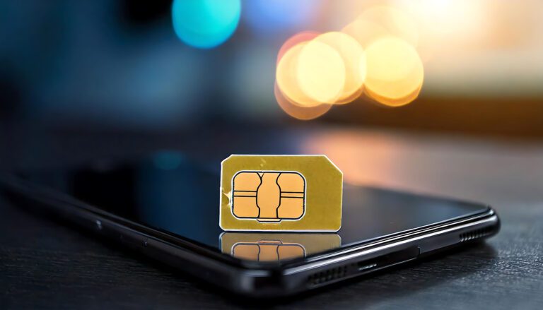 Close-up shot of a SIM card resting on a smartphone, bokeh background. Perfect for illustrating connectivity, mobile technology, or data concepts. Ideal for websites, blogs, or marketing materials.